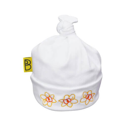 Handmade white Welsh organic cotton baby hat embroidered with yellow and orange daffodils and made in Wales by Babi Bw