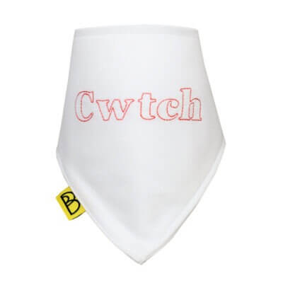 Organic cotton baby dribble bib with embroidered Welsh word Cwtch in red on to white cotton, its a triangular bib and has two red nickel-free poppers.