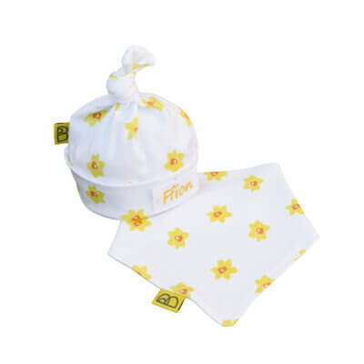 Handmade organic cotton baby hat and dribble bib featuring a Welsh daffodil design