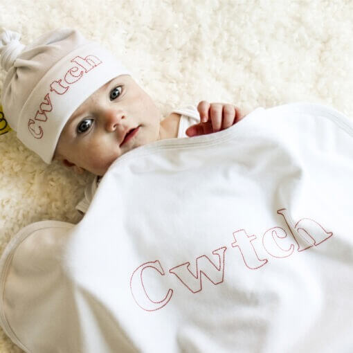 Organic Baby Blanket and Baby Hat embroidered in Welsh in red with Cwtch