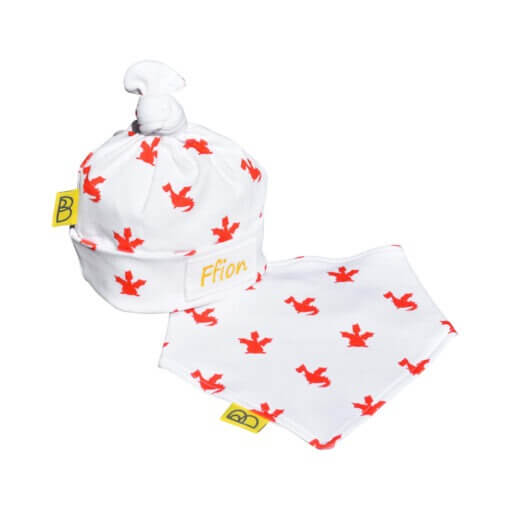 Organic baby hat & bib gift set both with our hand drawn red playful dragon print on to white cotton, the hat has a cute little hand tied knot on top.