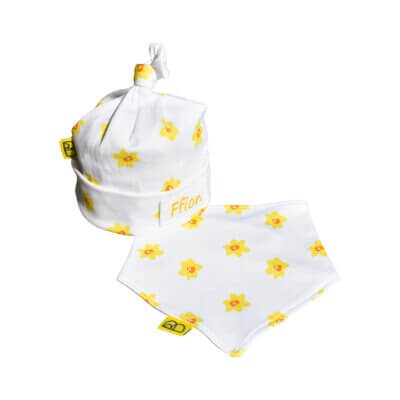 Organic baby hat & bib gift set with our hand drawn vibrant yellow daffodils print on to white cotton, the hat has a cute little hand tied knot on top