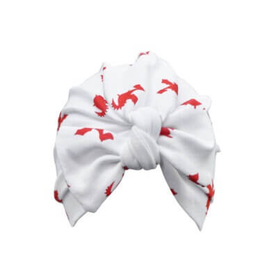 Handmade white organic cotton turban for baby or toddler with a bow in our red dragon print