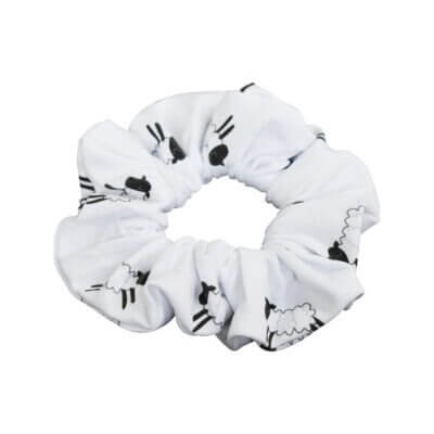 Handmade white organic cotton elasticated scrunchie for a little girl in a black & white sheep design