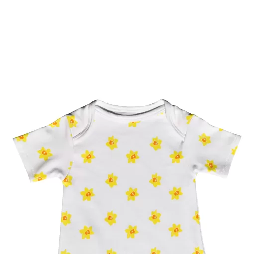 White short sleeved handmade organic cotton baby romper in vibrant daffodil design with fasteners at bottom for easy opening