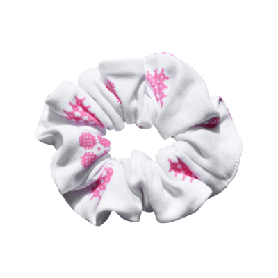 Handmade white organic cotton elasticated scrunchie for a little girl in a pink tapestry celtic pattern