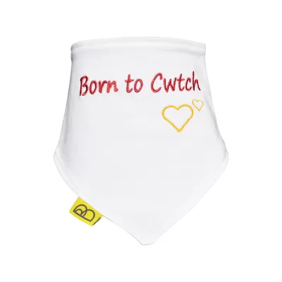 Organic cotton baby dribble bib with embroidered Welsh words in red, Born to Cwtch on to white cotton, its triangular and has red nickel-free poppers.