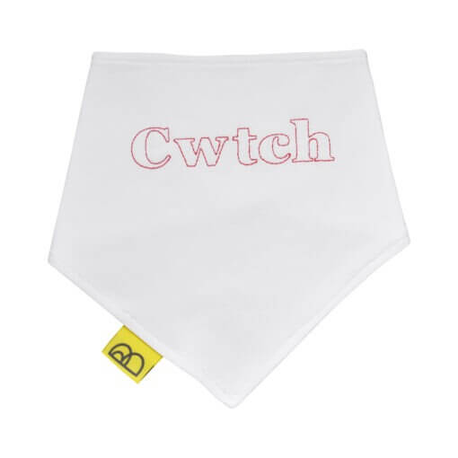 Organic cotton baby dribble bib with embroidered Welsh word Cwtch in red on to white cotton, its a triangular bib and has two red nickel-free poppers.