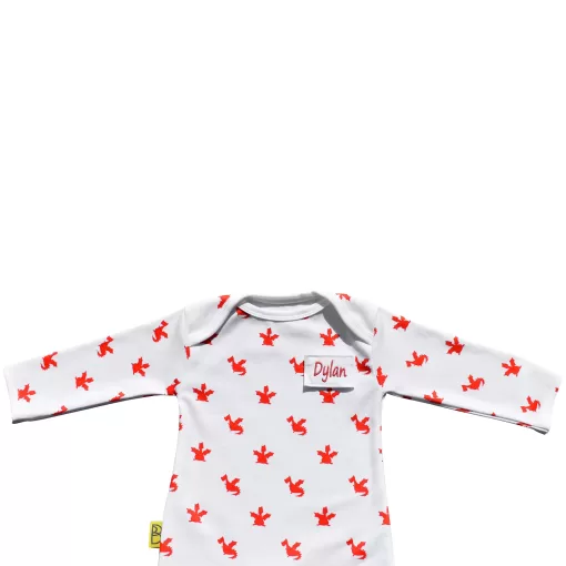 White organic cotton baby sleepsuit with cute red dragon design fasteners inside legs for easy opening, can be personalised