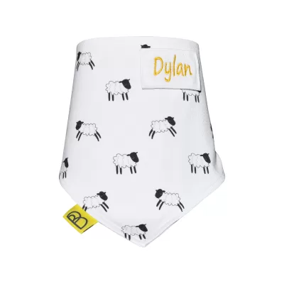 Handmade white organic cotton baby bib with black and white sheep design, one size and have two fastenings to adjust fit