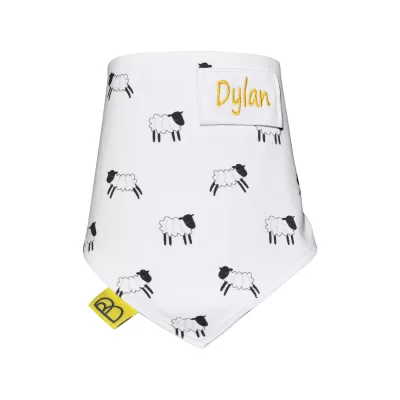 Handmade white organic cotton baby bib with black and white sheep design, one size and have two fastenings to adjust fit