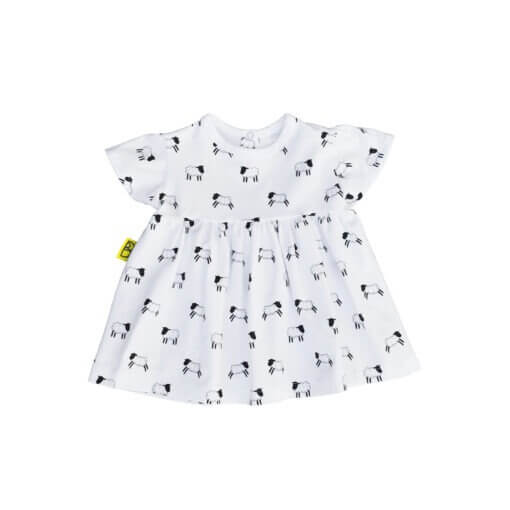 An organic cotton baby dress adorned with a Welsh sheep pattern.