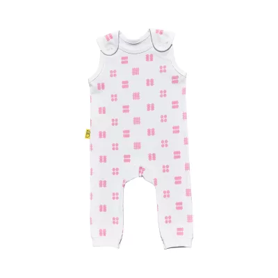 White organic handmade cotton baby dungarees with no sleeves in our pink tapestry design with two fasteners on each brace