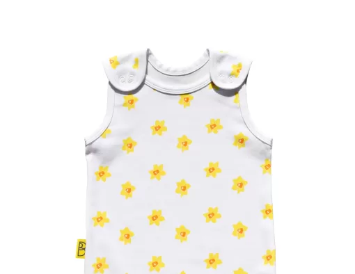 White organic handmade cotton baby dungarees with open sleeves in our vibrant daffodil design with two fasteners on each brace