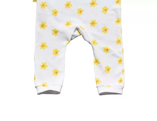 White organic handmade cotton baby dungarees with open sleeves in our vibrant daffodil design with two fasteners on each brace